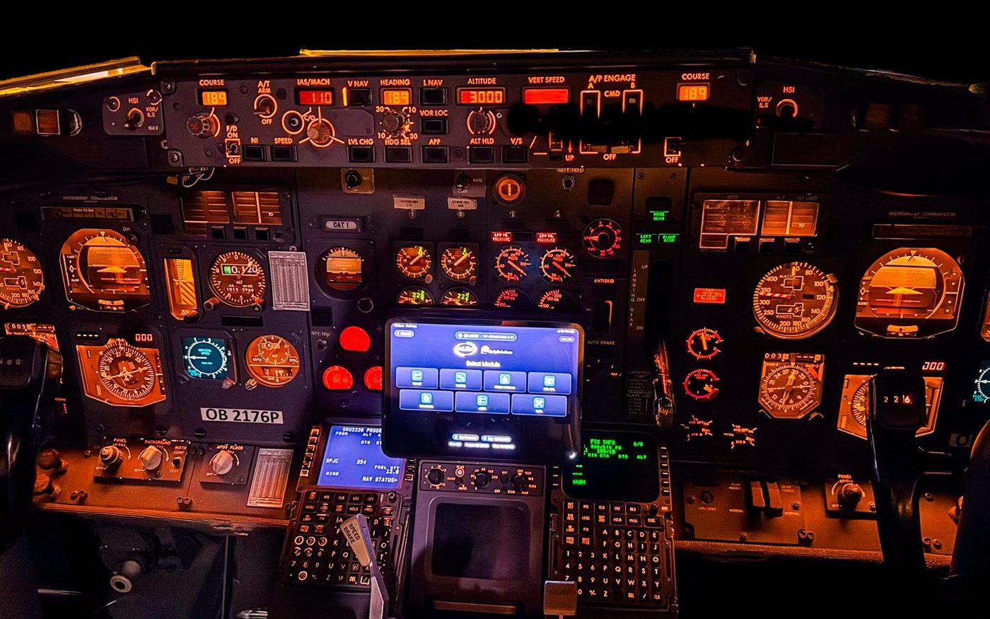 Boeing 737 flight deck at night with eLila EFB open on an iPad in the centre of the panel
