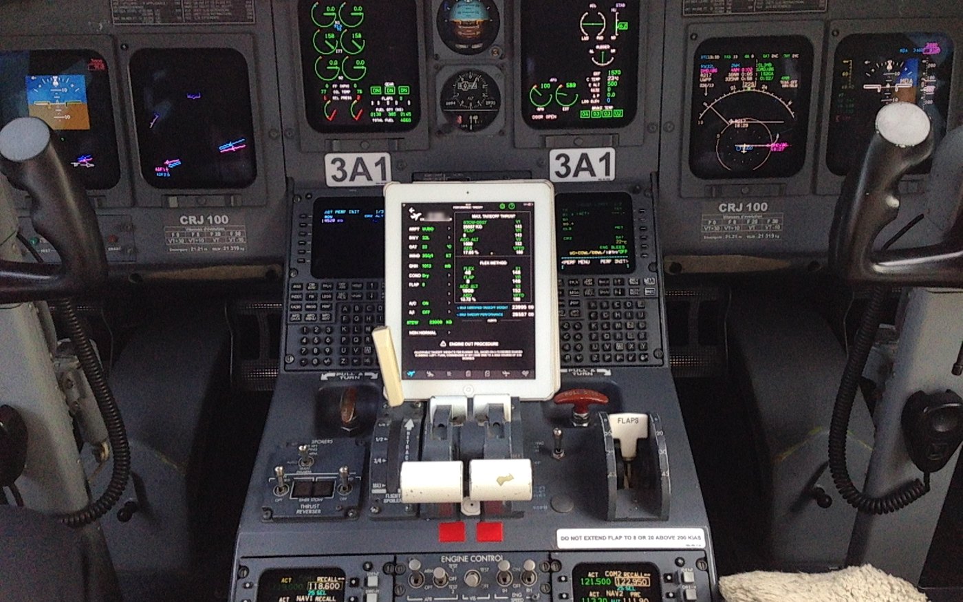 Bombardier CRJ 100 flight deck with eLila EFB on the centre pedestal showing a takeoff calculation